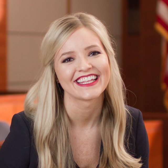 Color photo of a smiling female lawyer.